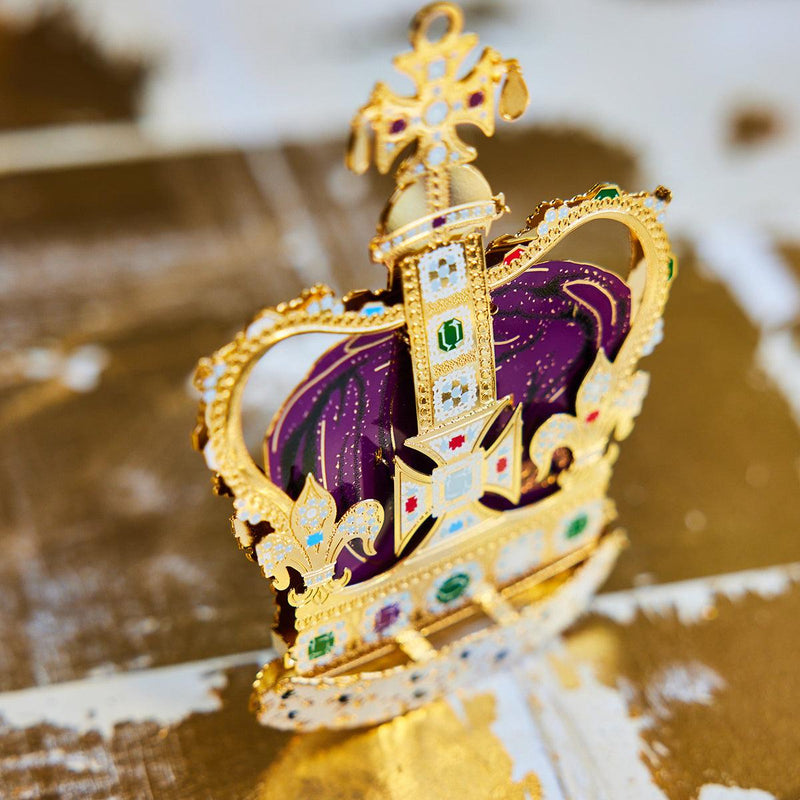 Handcrafted St Edward’s Crown Christmas Tree Ornament, in amazing color, featuring intricate 24-carat gold detailing and vibrant jewel embellishments. A royal symbol of British heritage by The London Christmas Company.